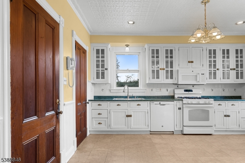 25 Old Turnpike Road Oldwick, NJ 08858 - Photo 17 of 46 a view of a kitchen with granite countertop a sink dishwasher a stove and a refrigerator