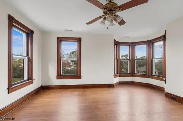 a view of a hallway with windows and stairs