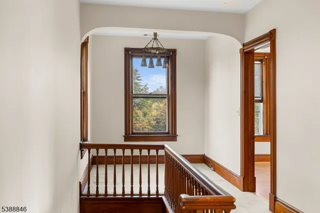 a view of a livingroom with a sofa and chandelier