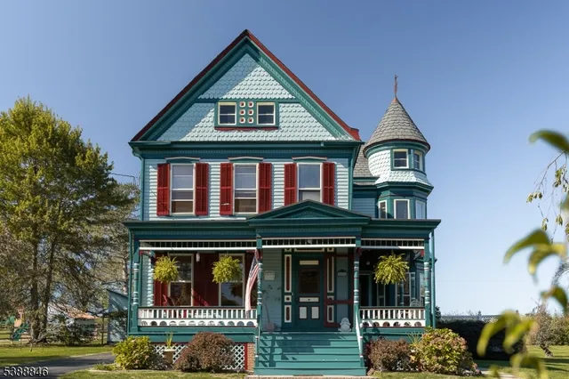 a front view of a residential apartment building with a yard