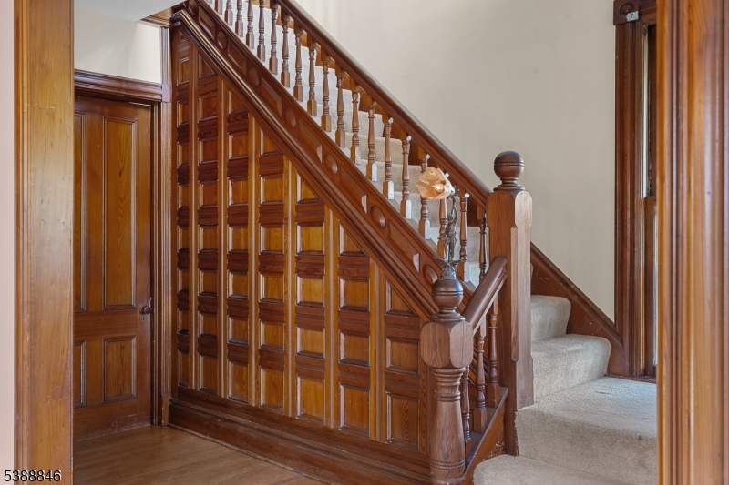 25 Old Turnpike Road Oldwick, NJ 08858 - Photo 10 of 46 a view of staircase with lots of frames on wall and a window