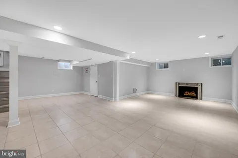 a view of an empty room with a fireplace