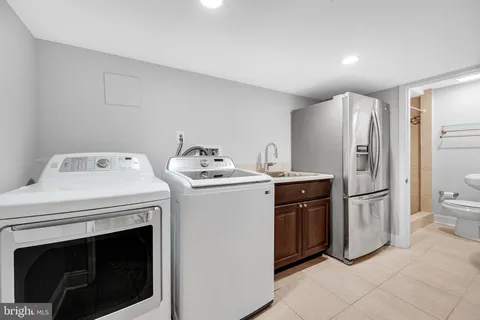 a kitchen with a stove sink and refrigerator