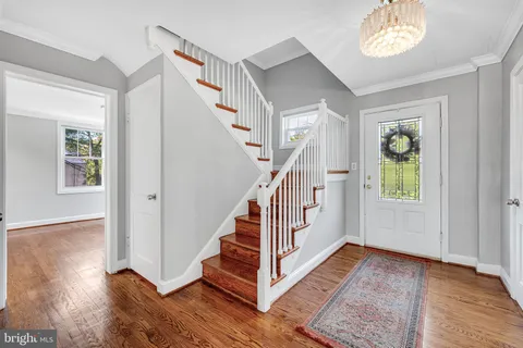 a view of entryway with wooden floor and window