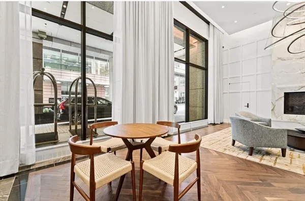 a view of a dining room with tables and chairs