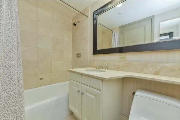a bathroom with a sink and a bathtub