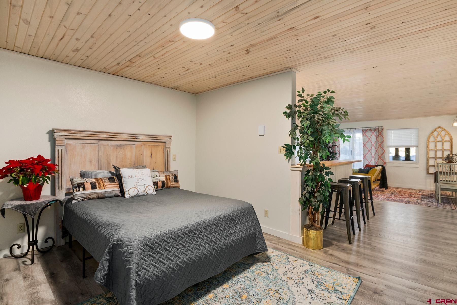 35 Emmons Road, Unit A Crested Butte, CO 81225 - Photo 12 of 28 a bedroom with a bed and a table