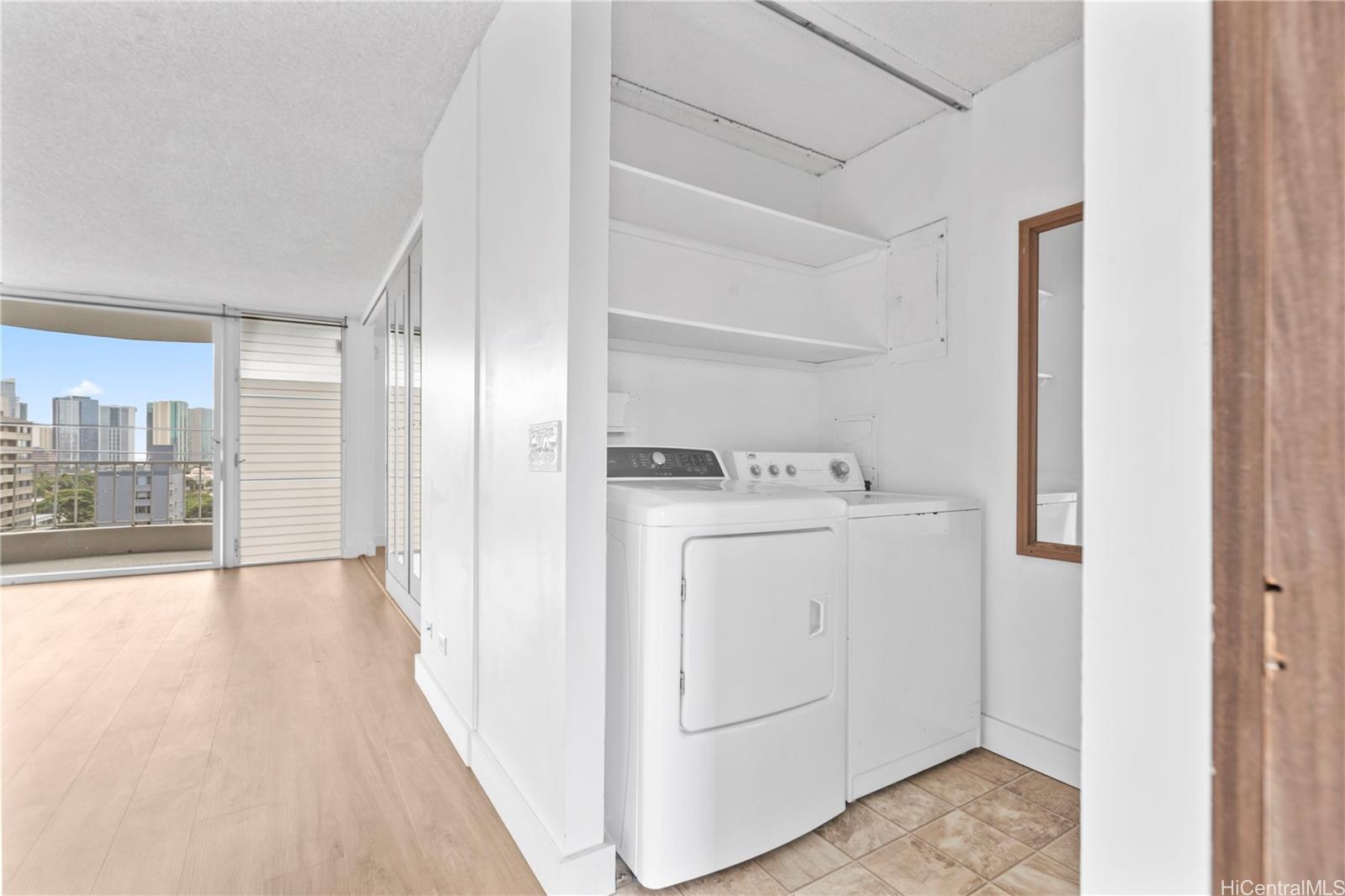 1018 Lunalilo Street, Unit 603 Honolulu, HI 96822 - Photo 9 of 12 a view of utility room with washer and dryer