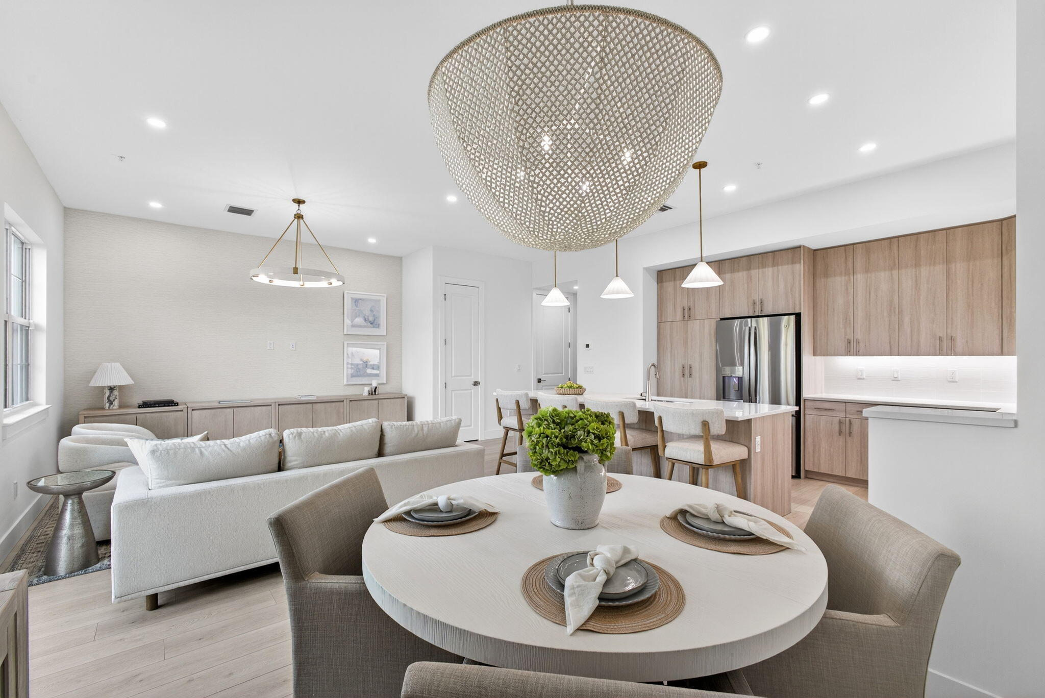 135 Water Pointe Place, Unit 22 Jupiter, FL 33477 - Photo 13 of 55 a living room with furniture kitchen and a chandelier