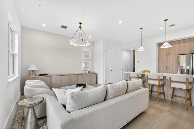 a spacious bedroom with a bed and a ceiling fan