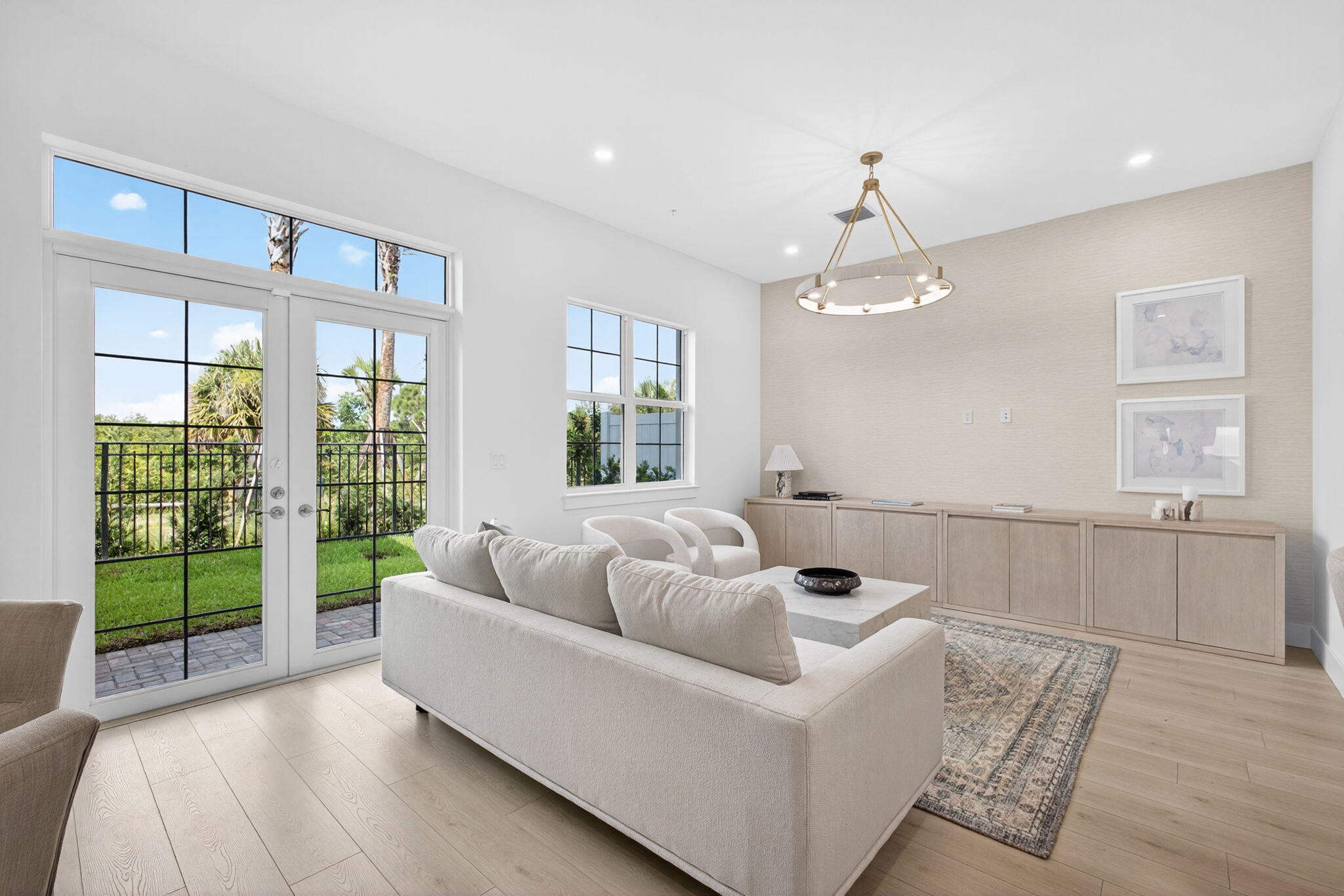 135 Water Pointe Place, Unit 22 Jupiter, FL 33477 - Photo 18 of 55 a living room with furniture and a large window