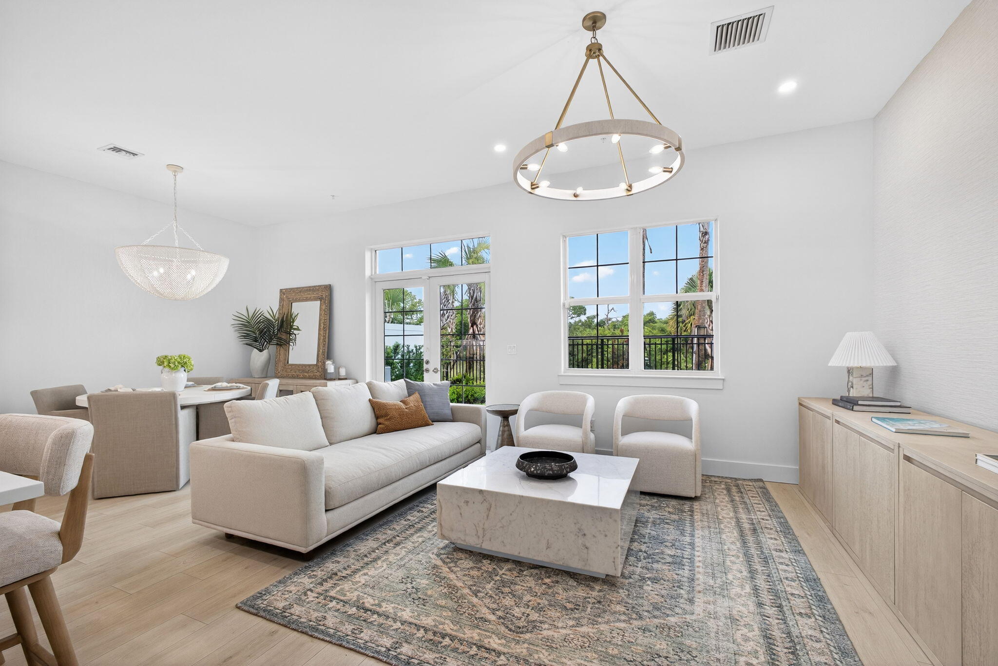 135 Water Pointe Place, Unit 22 Jupiter, FL 33477 - Photo 19 of 55 a living room with furniture and a large window