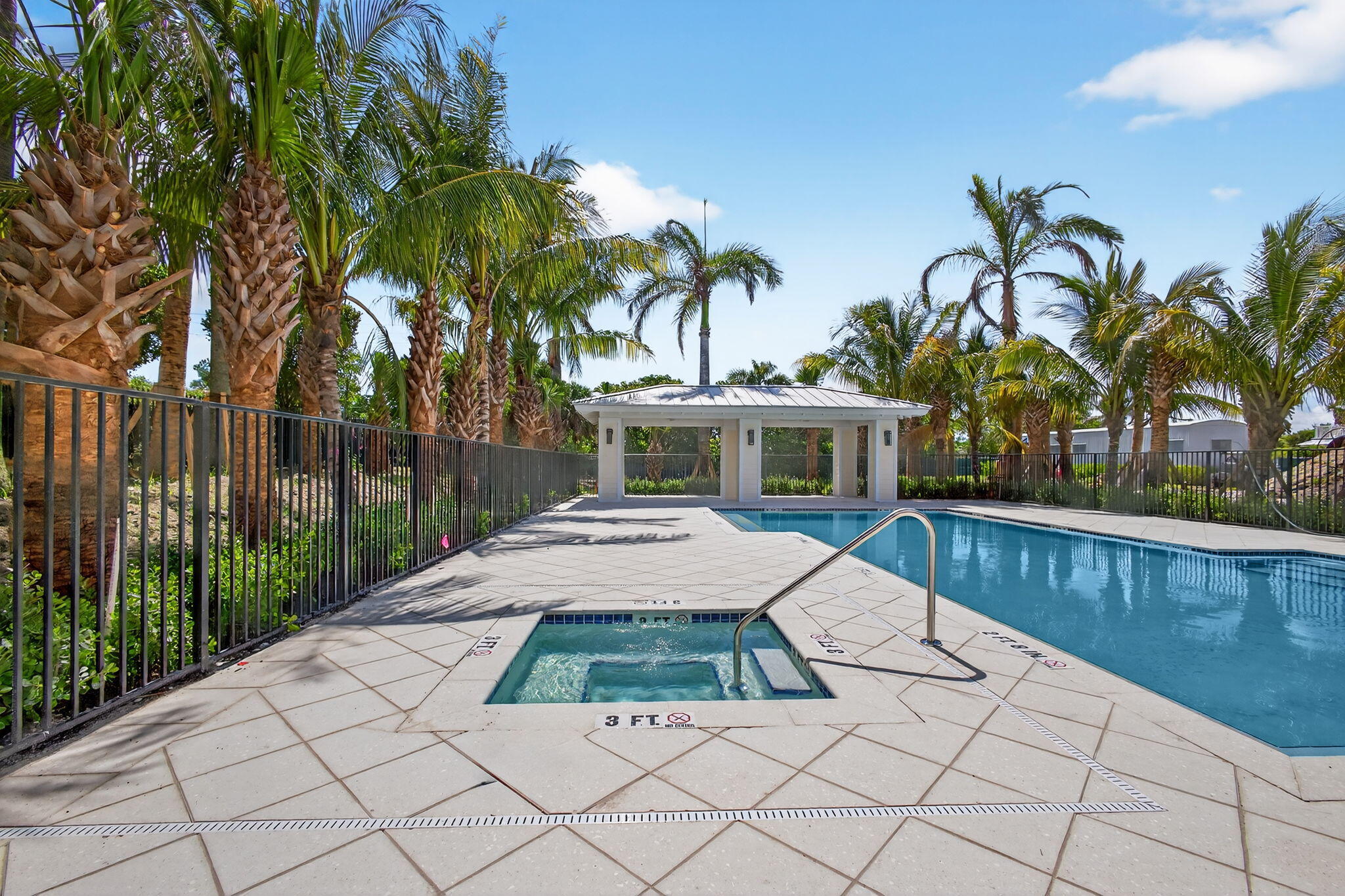135 Water Pointe Place, Unit 22 Jupiter, FL 33477 - Photo 53 of 55 a house with palm tree in front of it