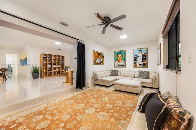 a bedroom with furniture and a flat screen tv