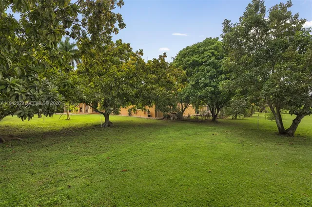 a kitchen with stainless steel appliances a refrigerator and a stove top oven