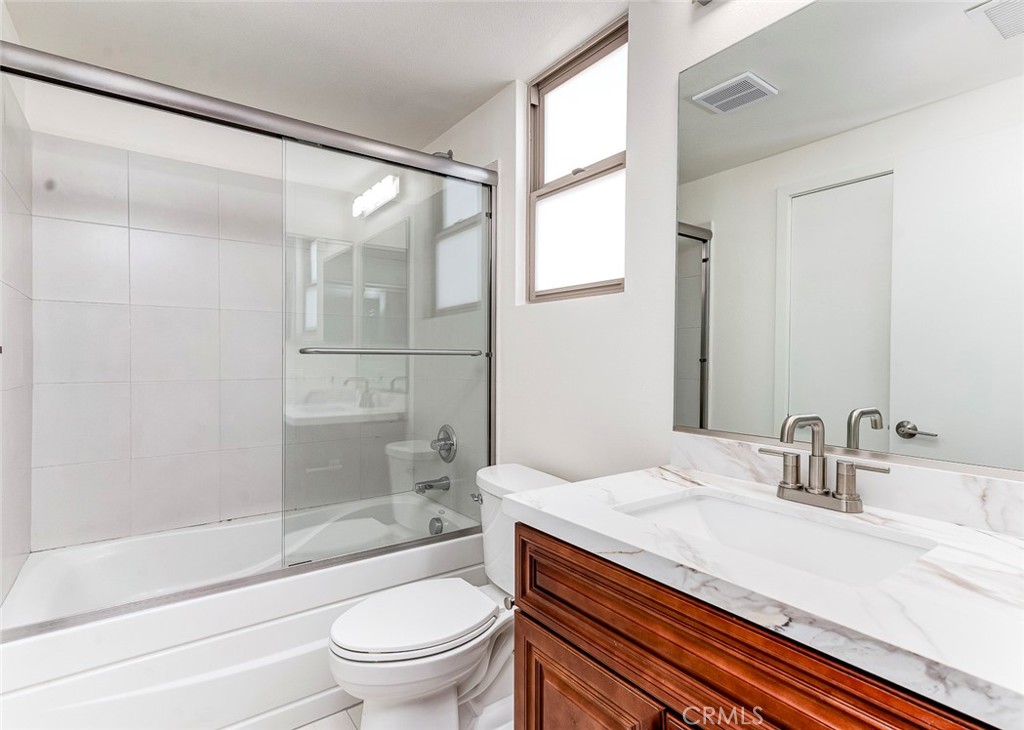 596 South Brea Boulevard Brea, CA 92821 - Photo 15 of 33 a bathroom with a granite countertop sink toilet and shower