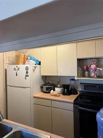 a bedroom with a bed and dresser