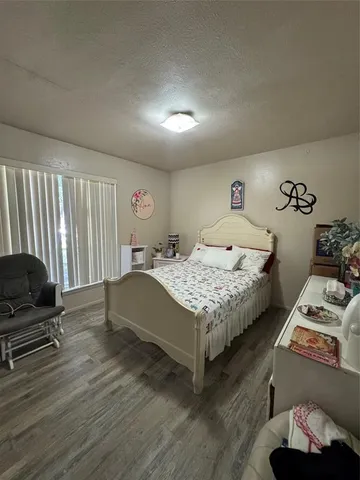 a bathroom with a sink mirror and toilet