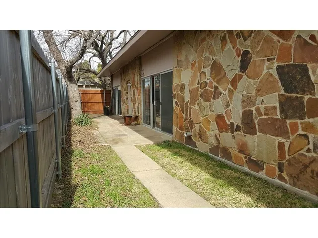 a view of balcony with furniture