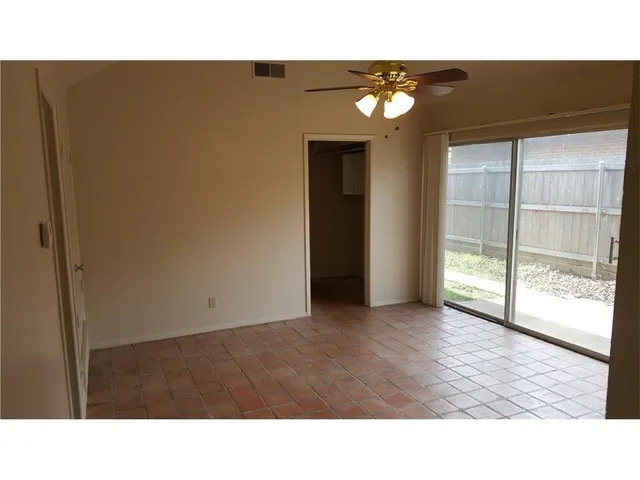 a view of a dining room with furniture and window