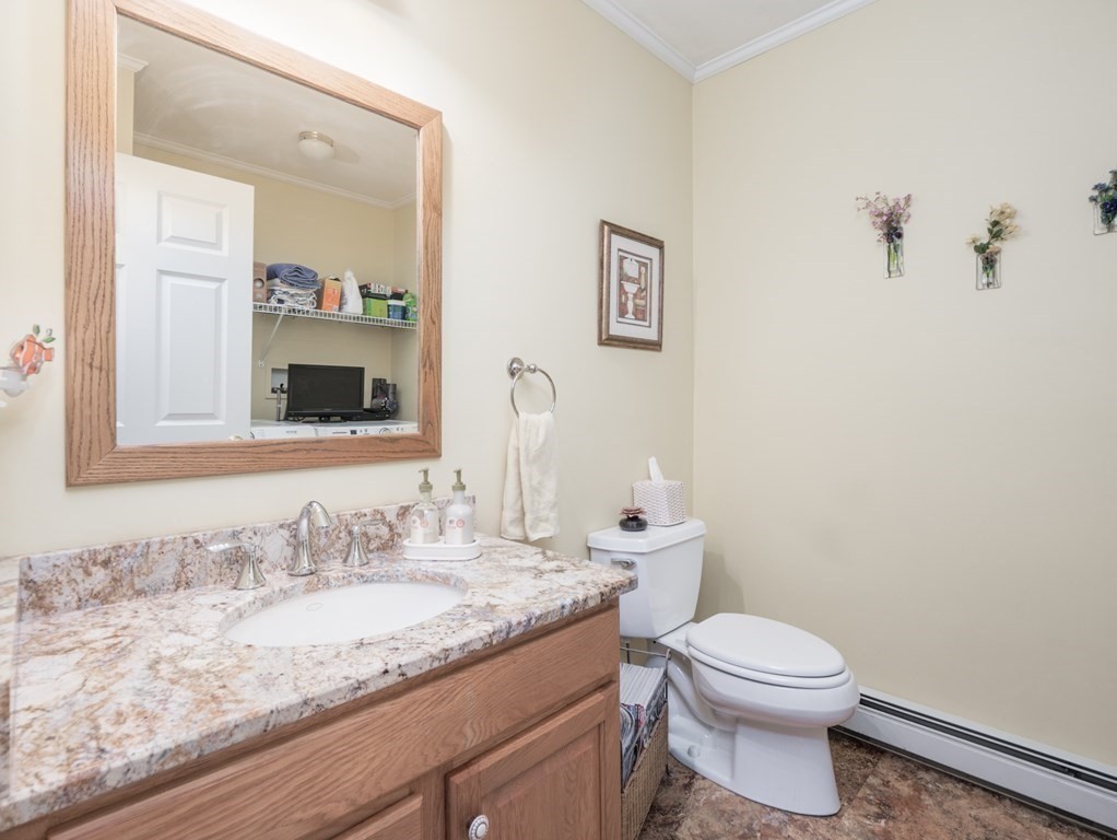 14 Talbott Farm Drive Mendon, MA 01756 - Photo 18 of 40 a bathroom with a granite countertop toilet sink and mirror