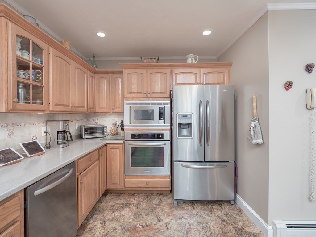 14 Talbott Farm Drive Mendon, MA 01756 - Photo 10 of 40 a kitchen with stainless steel appliances granite countertop a refrigerator a stove a sink and a microwave