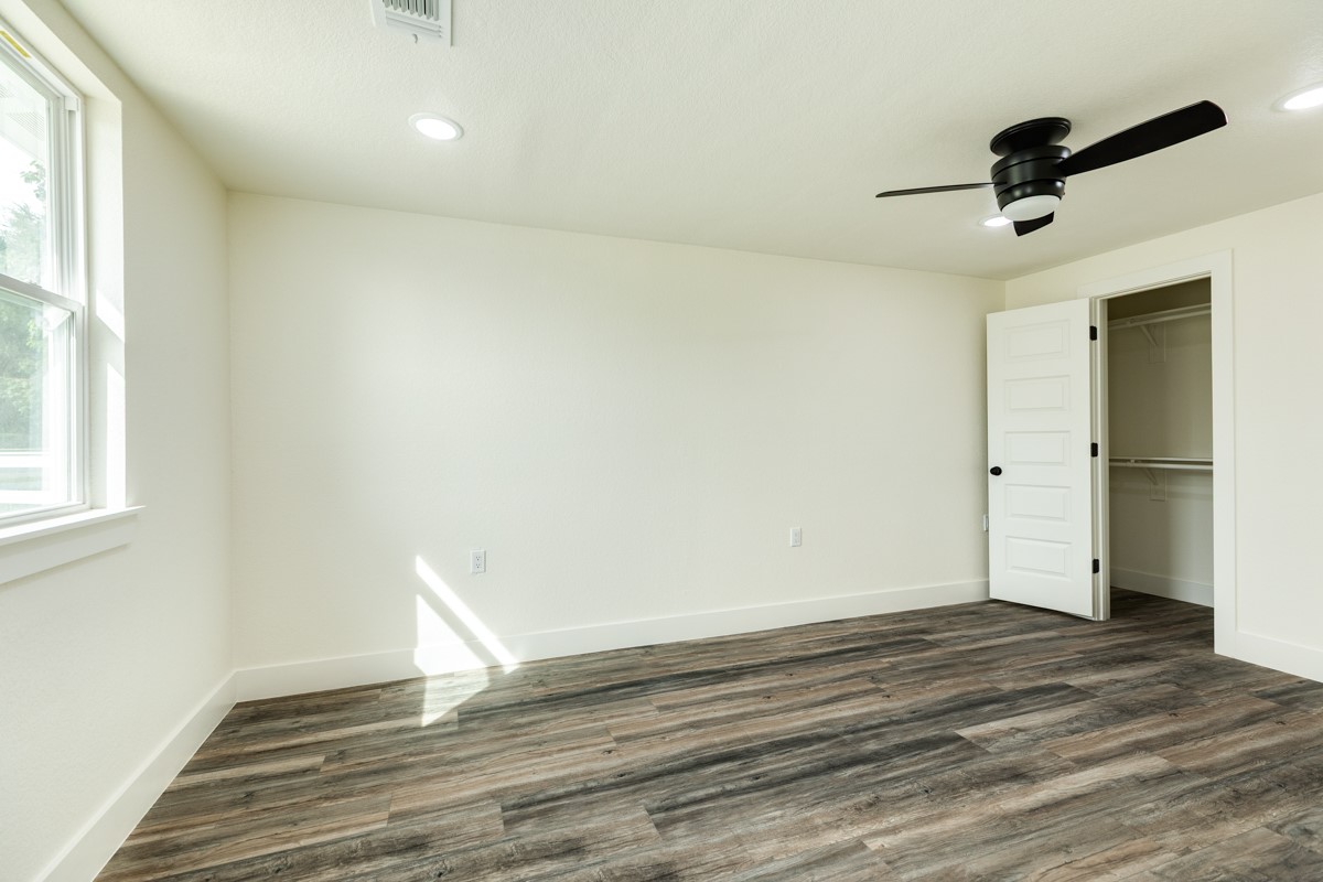1200 Gifford Lane Angleton, TX 77515 - Photo 19 of 26 a view of empty room with wooden floor
