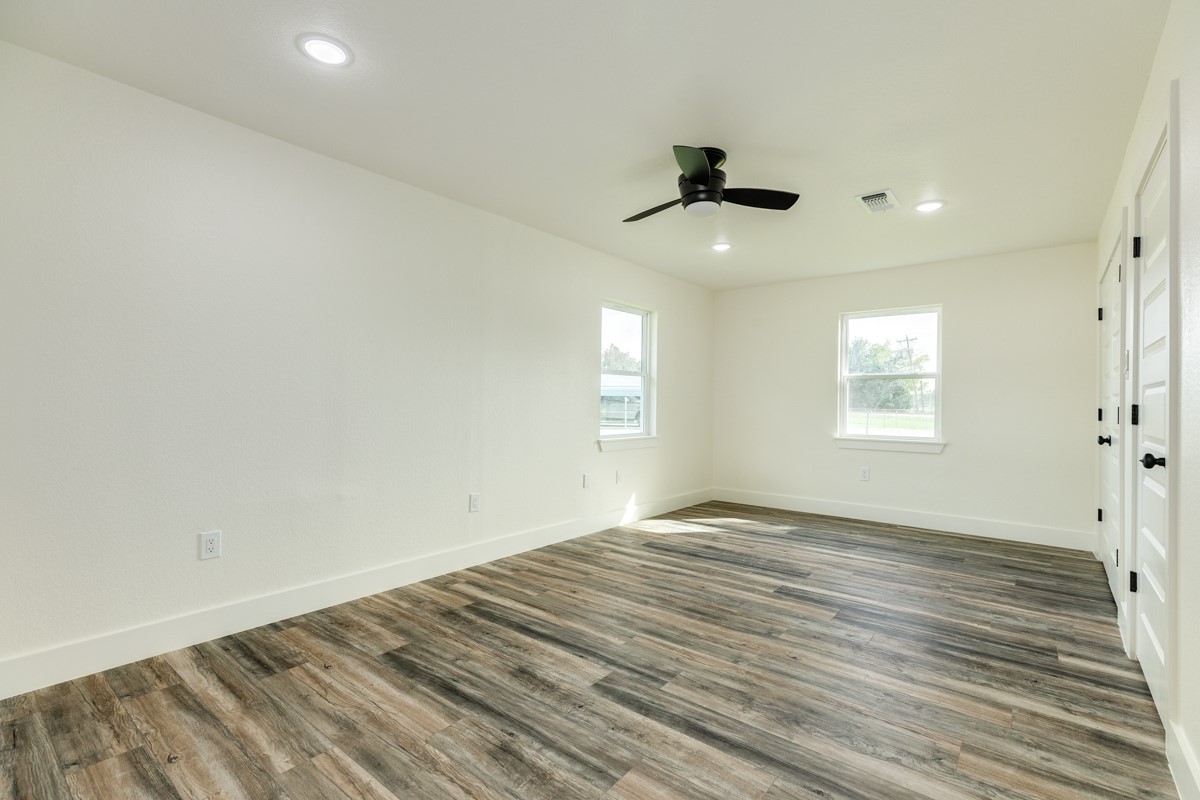 1200 Gifford Lane Angleton, TX 77515 - Photo 22 of 26 wooden floor in an empty room with a window