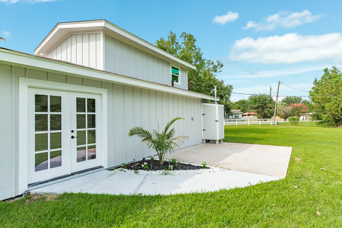 1200 Gifford Lane Angleton, TX 77515 - Photo 7 of 26 a white house with a yard and plants