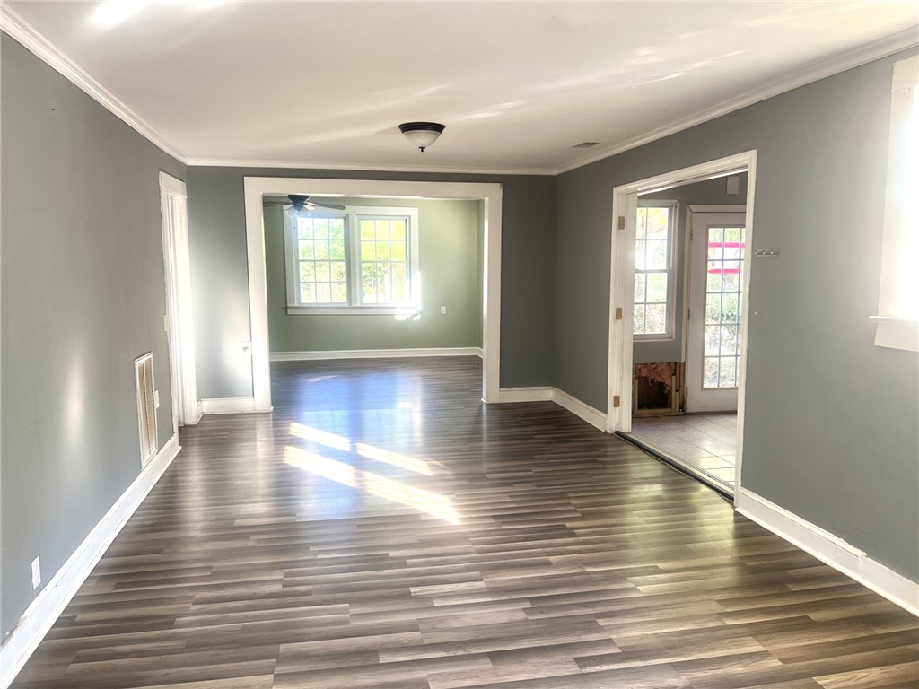 252 Friendship Road Seneca, SC 29678 - Photo 3 of 11 Gleaming wood floors anchor this open layout framed by crisp white trim work.