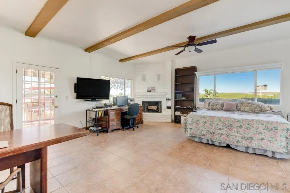 1690 Jackson Road Fallbrook, CA 92028 - Photo 26 of 33 a living room with furniture and a flat screen tv