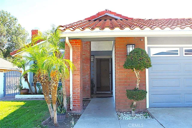 a front view of a house with garden