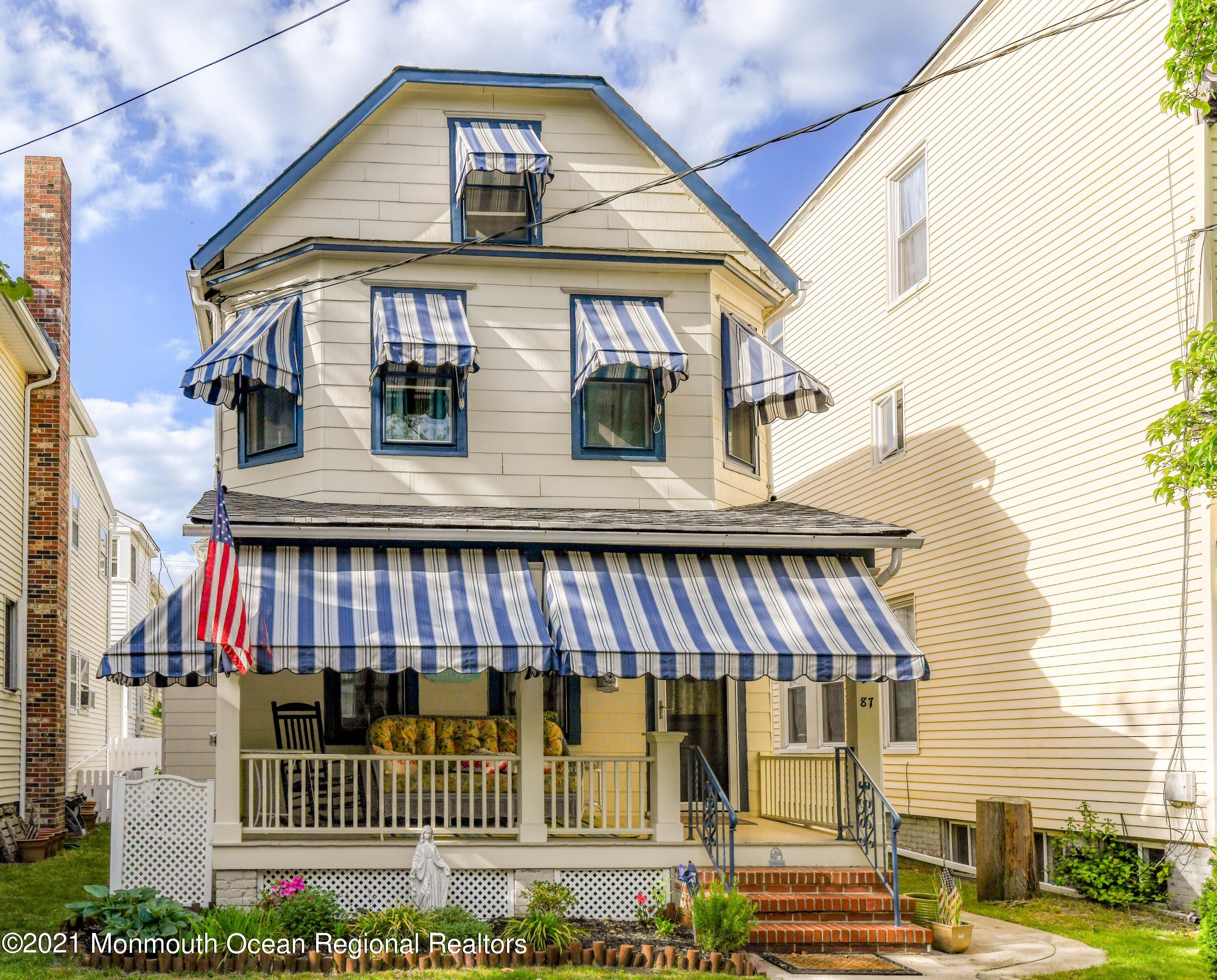 87 Embury Avenue Ocean Grove, NJ 07756 - Photo 3 of 55 a view of a brick building with many windows