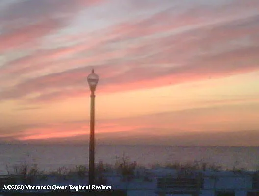 a couple of cars parked in front of building