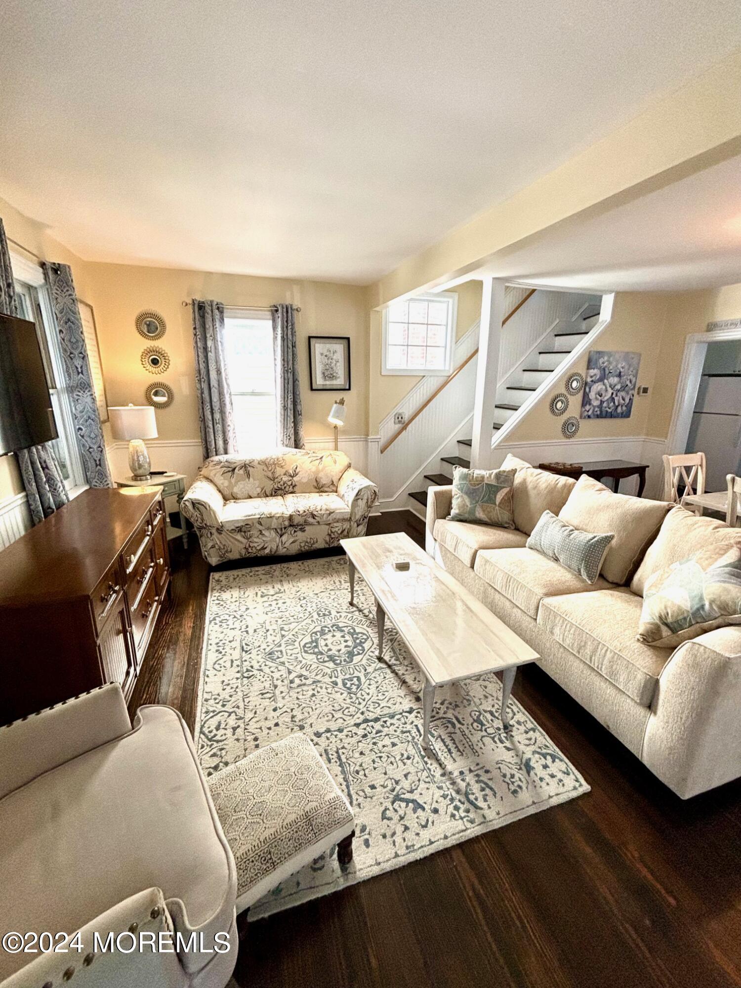 87 Embury Avenue Ocean Grove, NJ 07756 - Photo 8 of 55 a living room with furniture and a couch