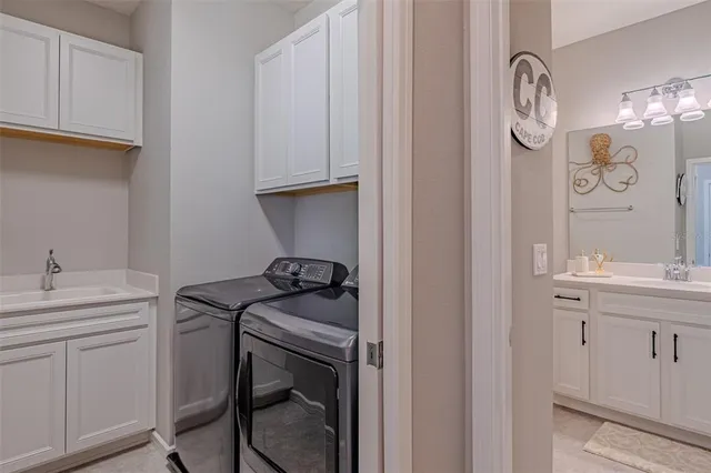 a utility room with cabinets