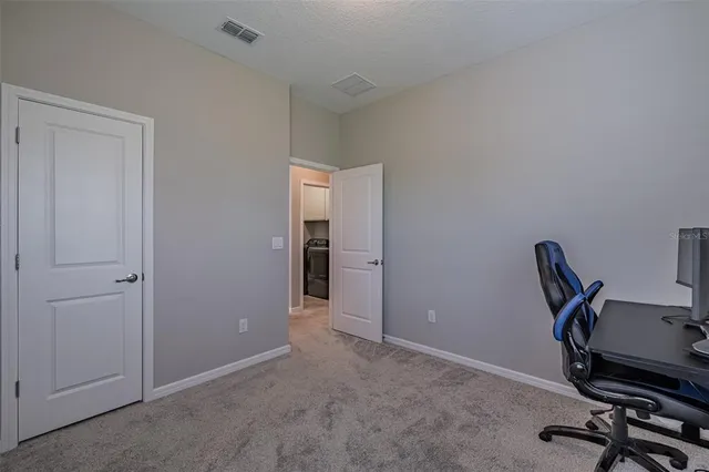 a view of a workspace with furniture