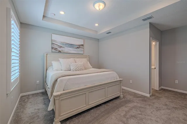 a room with a bed and a window