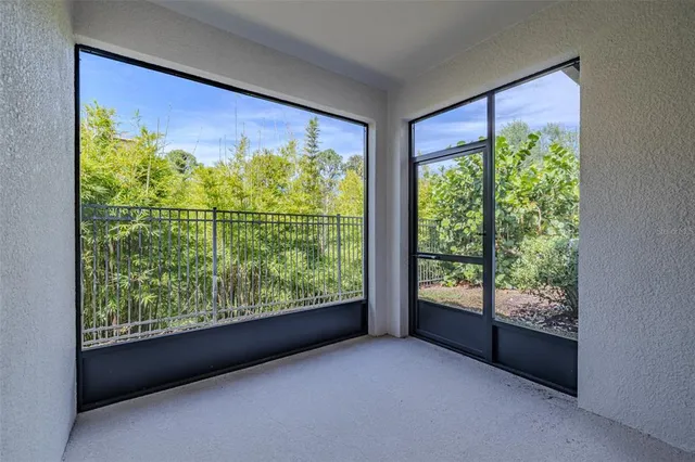 a view of an empty room with a large window