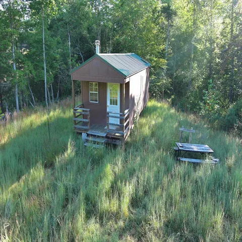 a aerial view of a house with a yard