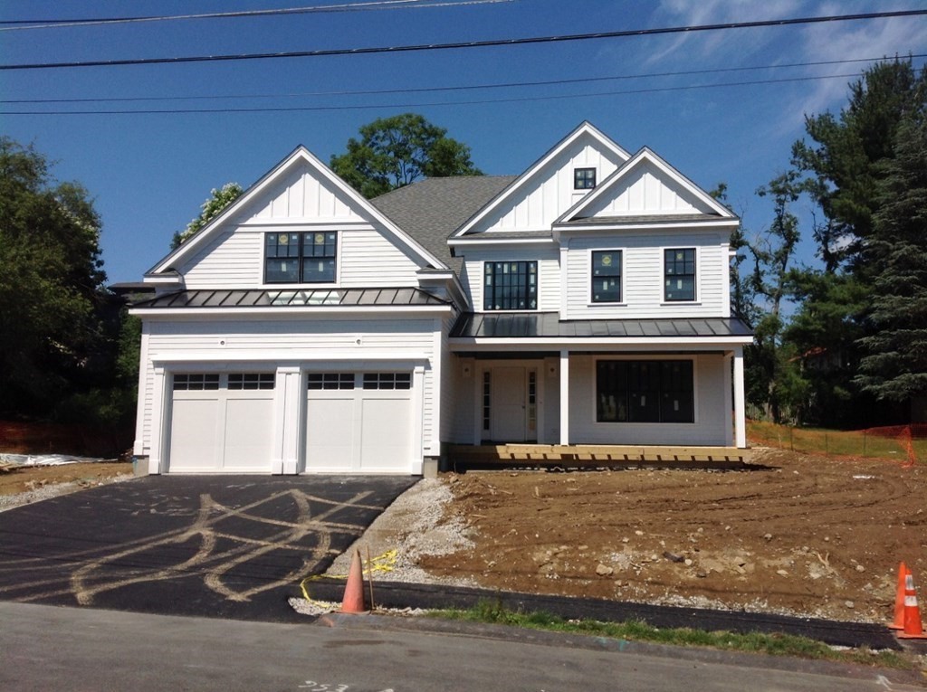 71 Elder Road Needham, MA 02494 - Photo 1 of 24 a front view of a house with a yard
