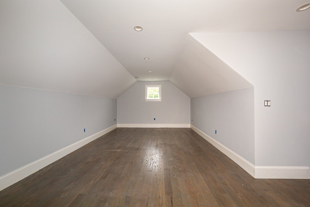 71 Elder Road Needham, MA 02494 - Photo 21 of 24 an empty room with wooden floor and windows