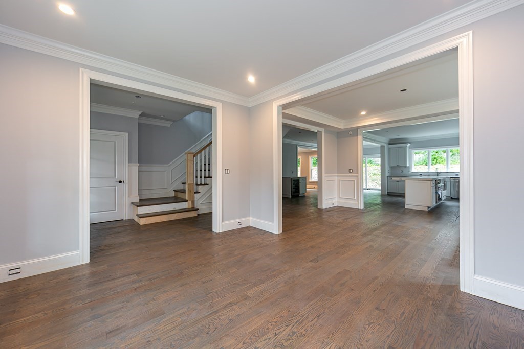71 Elder Road Needham, MA 02494 - Photo 3 of 24 a view of an empty room with wooden floor and a cabinet