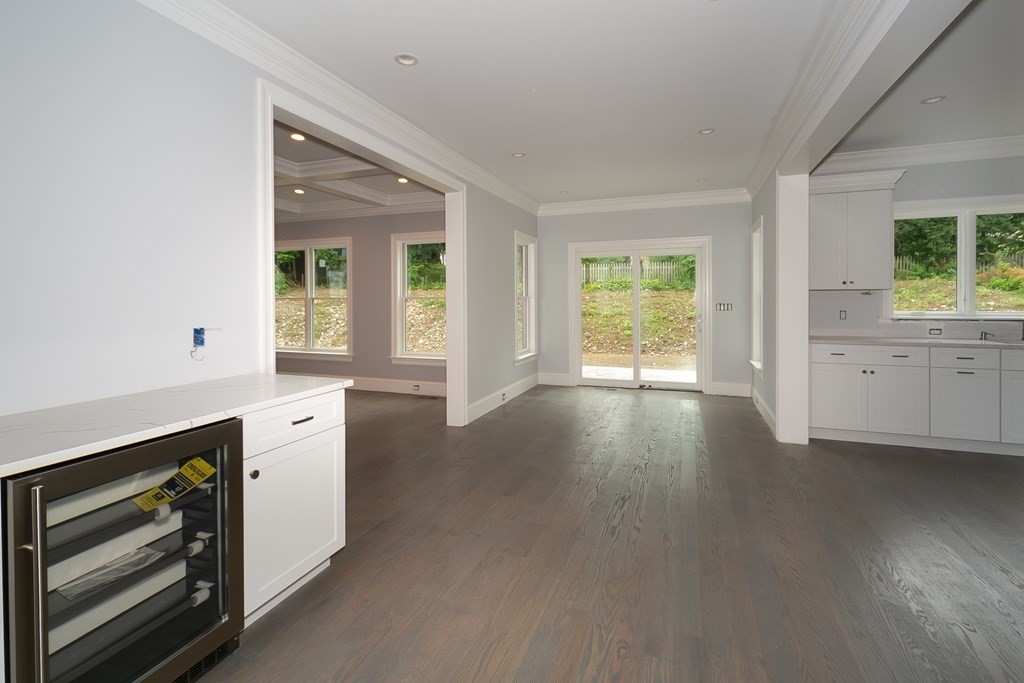 71 Elder Road Needham, MA 02494 - Photo 4 of 24 an empty room with wooden floor and windows