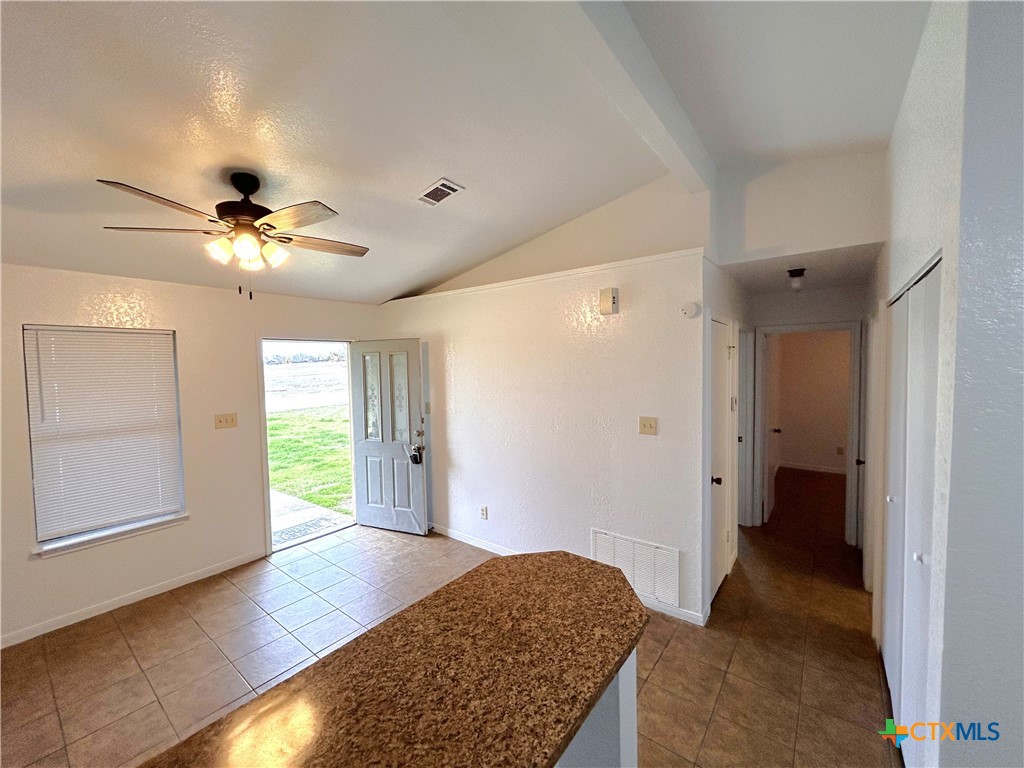 10411 Chaparral Road Killeen, TX 76548 - Photo 6 of 13 a view of a livingroom with a ceiling fan and window