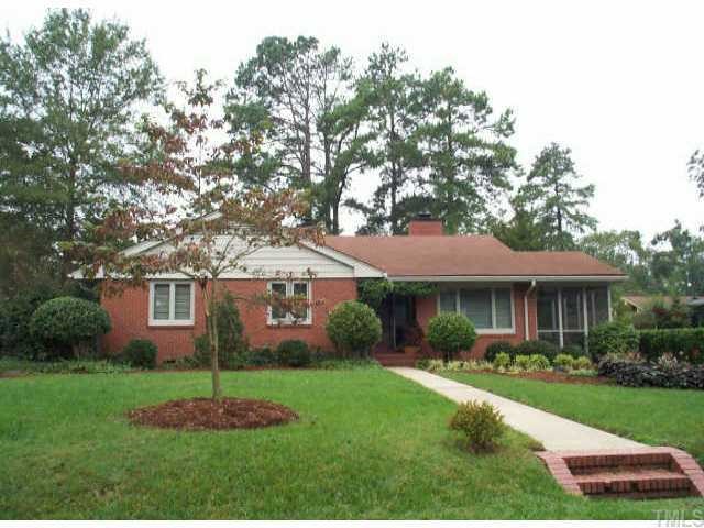 1315 Canterbury Road Raleigh, NC 27607 - Photo 1 of 1 a front view of a house with a garden