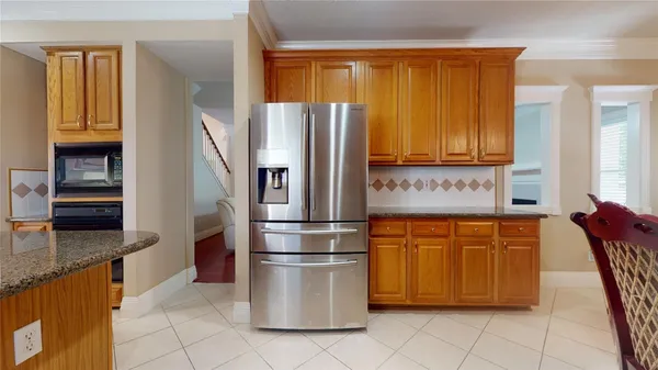 a kitchen with kitchen island a stove and a sink