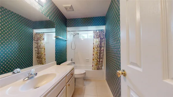 a bathroom with a sink a mirror and a shower