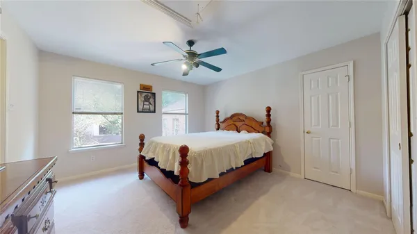 a view of a livingroom with workspace and a window