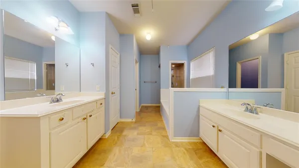 a view of a room with wooden floor and lounge chair